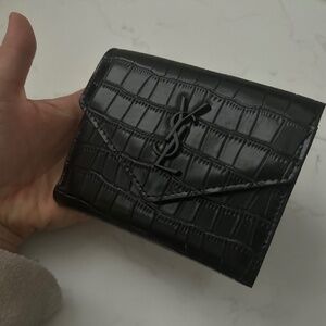 Authentic YSL black leather wallet .